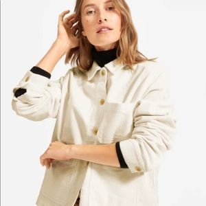 White Everlane corduroy jacket.